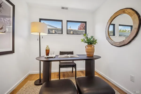 a bedroom with a bed and the window