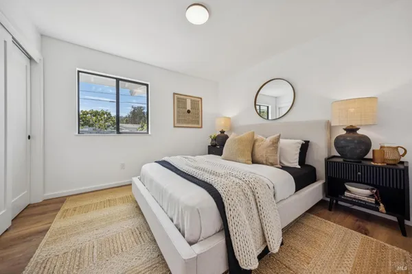 a bedroom with a bed and a table in it