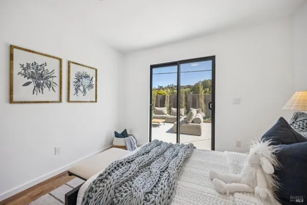 a view of a balcony with chair and wooden floor