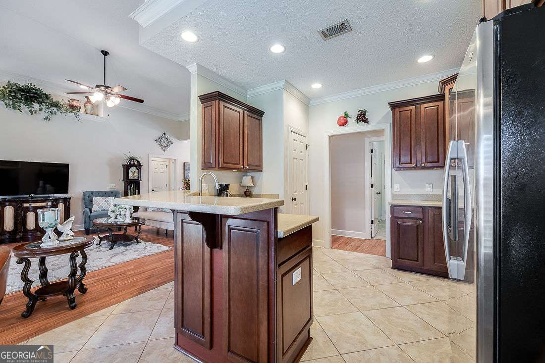 110 Cobbleton Drive Rincon, GA 31326 - Photo 19 of 41 a large kitchen with a large counter top appliances and cabinets