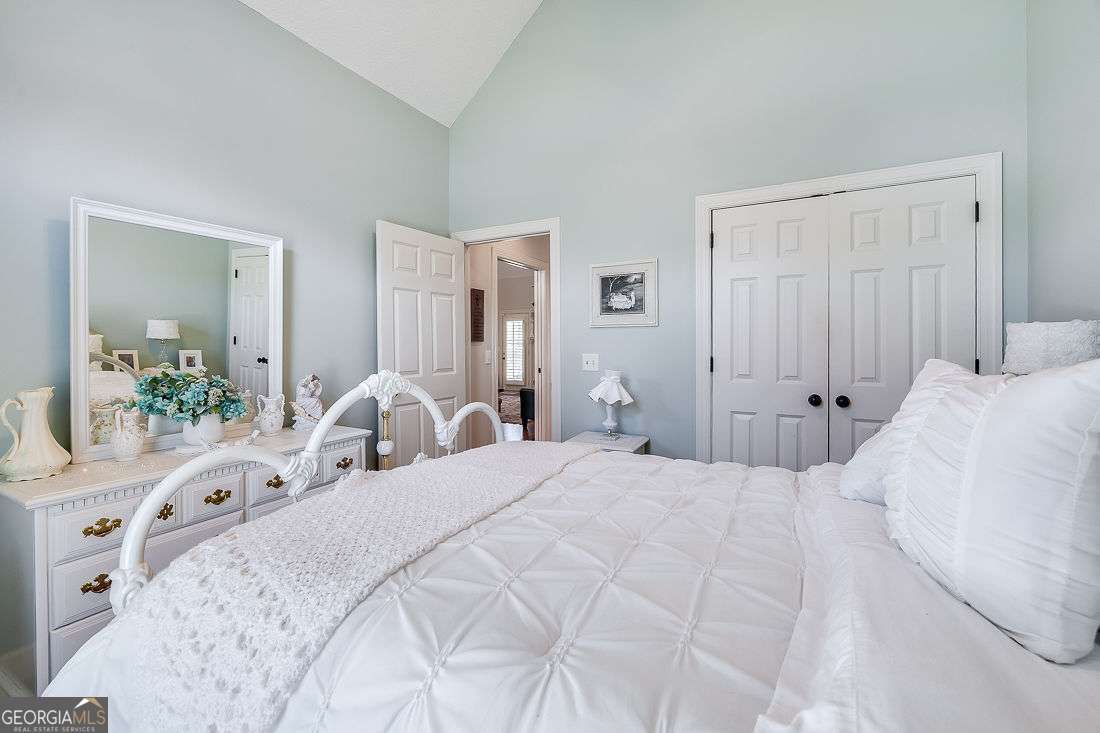 110 Cobbleton Drive Rincon, GA 31326 - Photo 28 of 41 a bedroom with a bed and a mirror