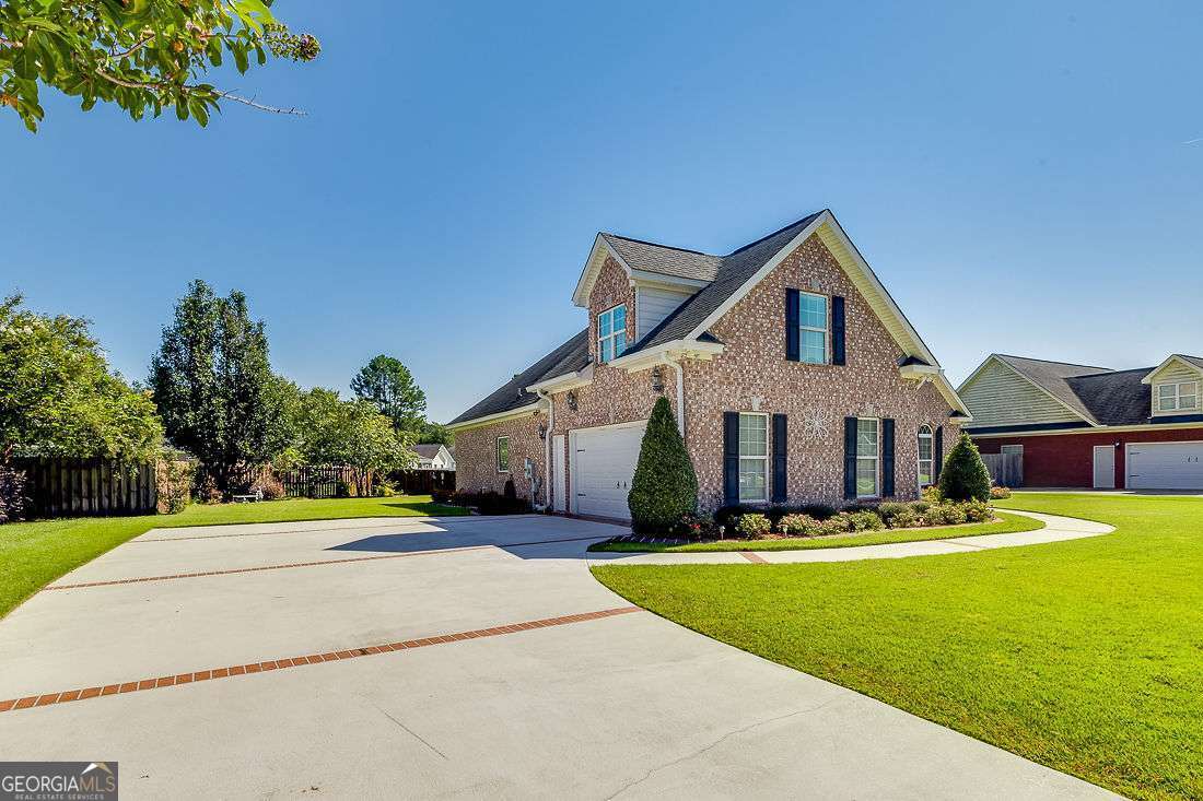 110 Cobbleton Drive Rincon, GA 31326 - Photo 4 of 41 a front view of house with yard and green space