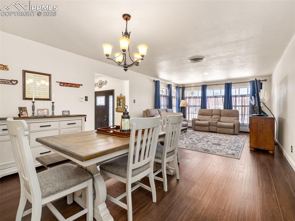 20 Robertson Road Pueblo, CO 81001 - Photo 12 of 39 a view of a dining room with furniture and wooden floor