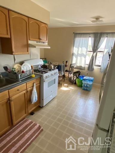 1621 Raspberry Court Edison, NJ 08817 - Photo 4 of 8 a kitchen with stainless steel appliances granite countertop a stove a sink and a refrigerator
