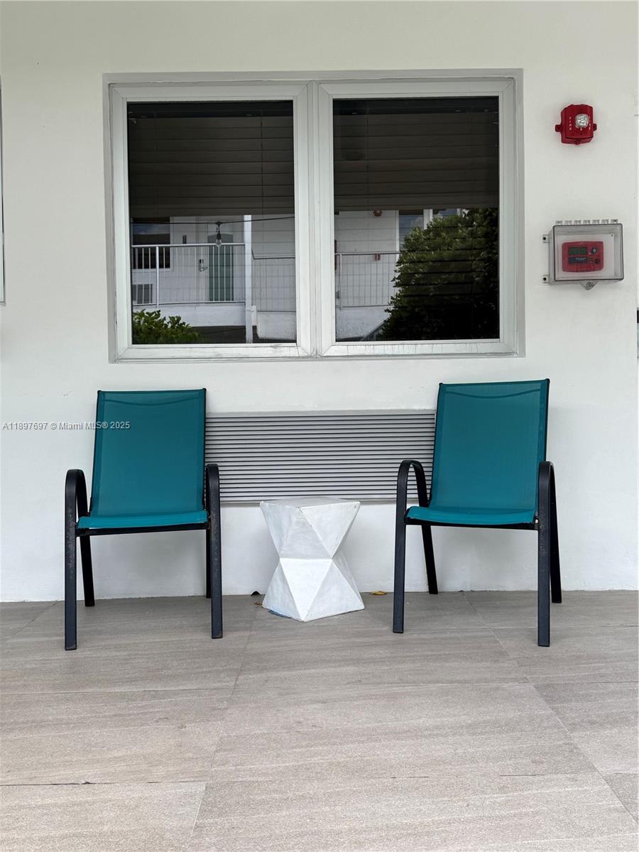 6755 Harding Avenue, Unit 2 Miami Beach, FL 33141 - Photo 10 of 10 a living room with furniture and a potted plant
