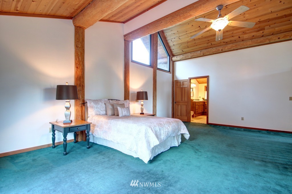4567 Mosquito Lake Road Deming, WA 98244 - Photo 15 of 25 a bedroom with a bed and a window