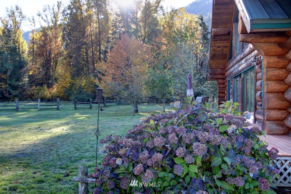 4567 Mosquito Lake Road Deming, WA 98244 - Photo 6 of 25 a view of a house with a big yard and large trees