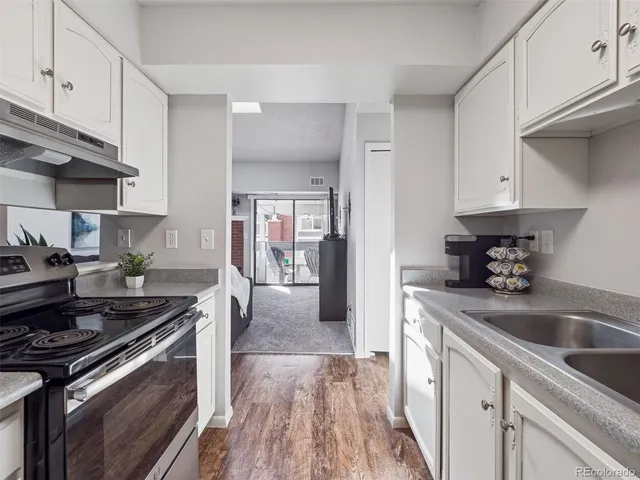 a kitchen with a stove and a sink