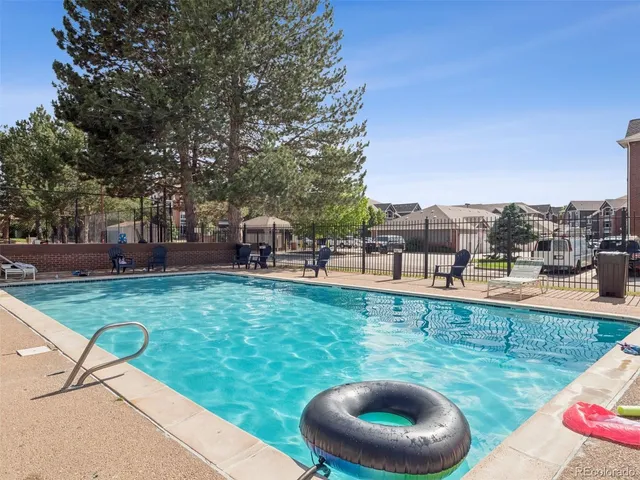 a view of a backyard with sitting area