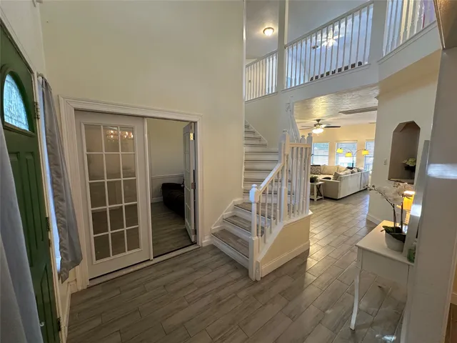 a view of an entryway with wooden floor
