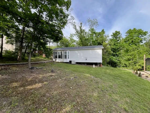 a view of a house with a back yard