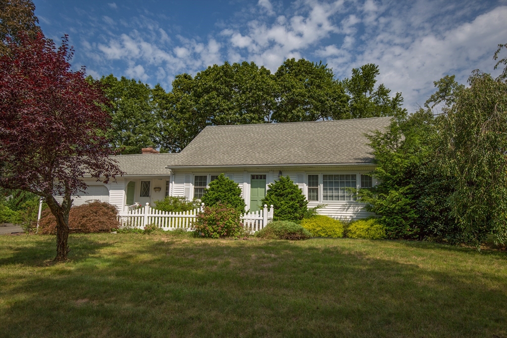176 Wolf Swamp Road Longmeadow, MA 01106 - Photo 1 of 40 a front view of a house with a garden