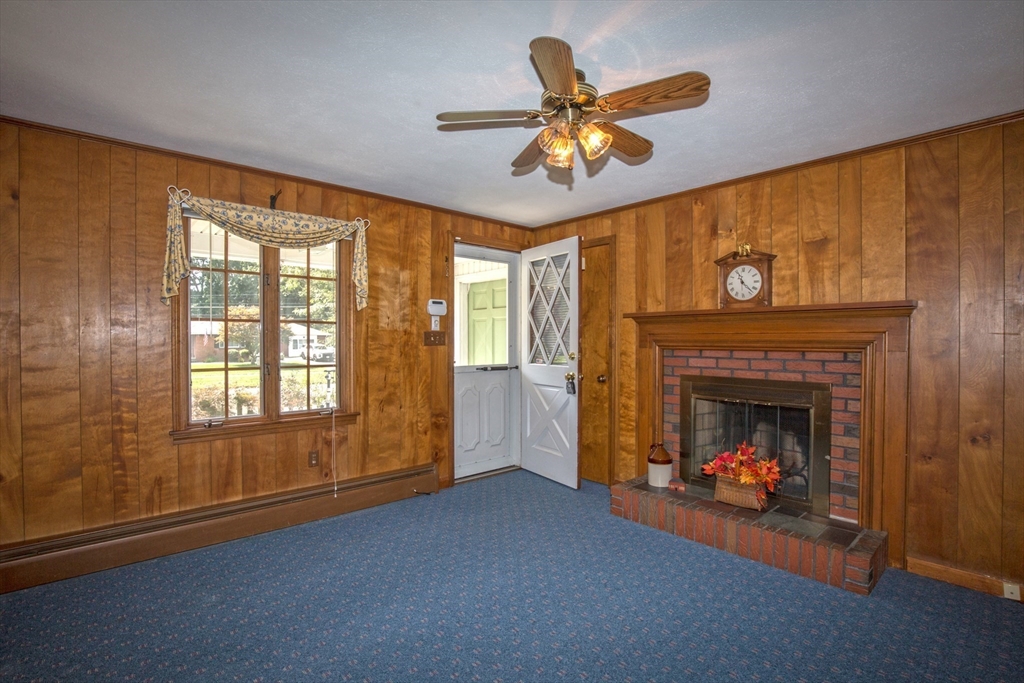 176 Wolf Swamp Road Longmeadow, MA 01106 - Photo 12 of 40 a living room with furniture and a fireplace