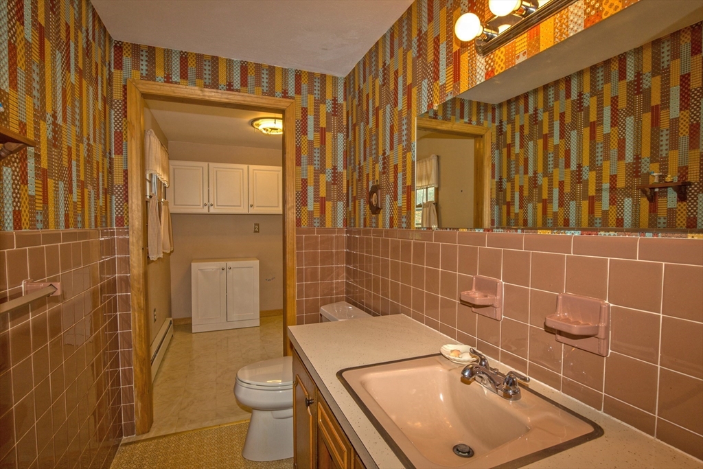 176 Wolf Swamp Road Longmeadow, MA 01106 - Photo 17 of 40 a bathroom with a sink a toilet and shower