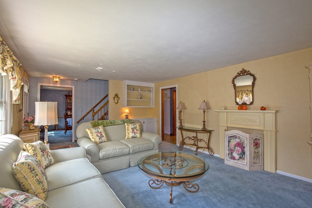 176 Wolf Swamp Road Longmeadow, MA 01106 - Photo 3 of 40 a living room with furniture and a wooden floor