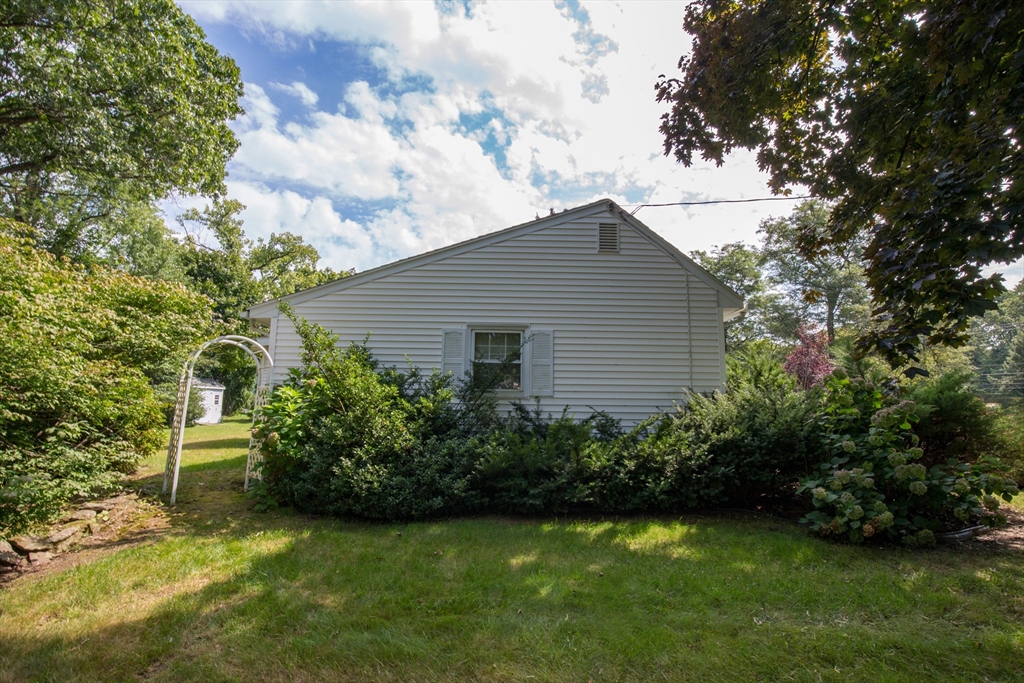 176 Wolf Swamp Road Longmeadow, MA 01106 - Photo 32 of 40 a view of a backyard with plants and large trees