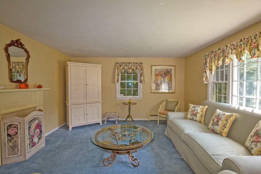 176 Wolf Swamp Road Longmeadow, MA 01106 - Photo 4 of 40 a living room with furniture and a floor to ceiling window