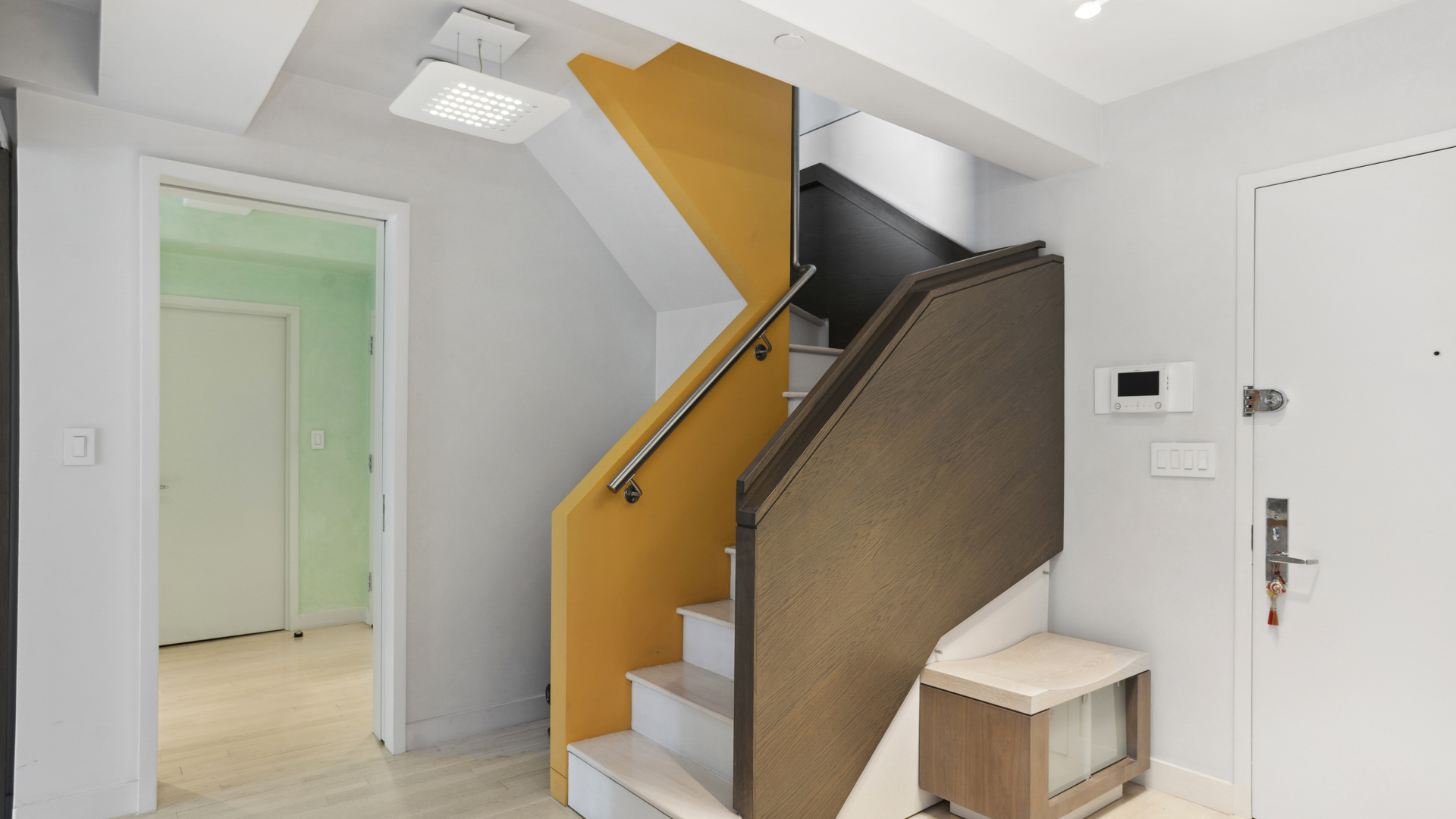 435 East 76th Street, Unit 6A Manhattan, NY 10021 - Photo 9 of 13 a view of entryway and kitchen