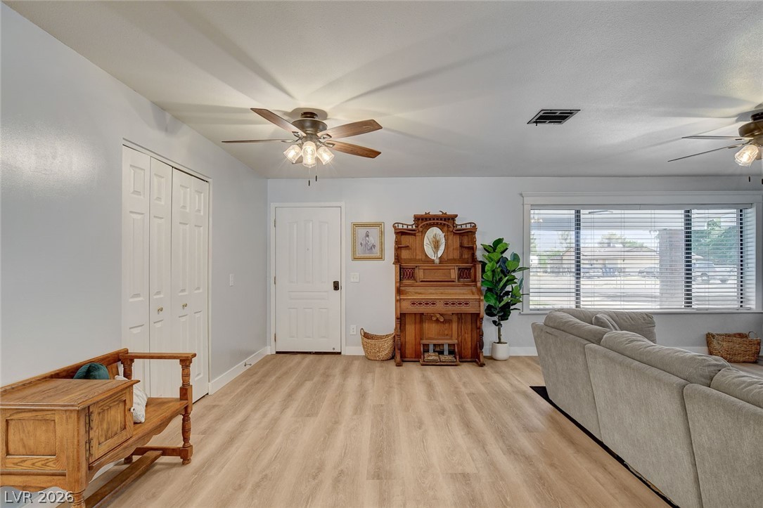3765 Berkeley Street Logandale, NV 89021 - Photo 3 of 87 This bright living area features abundant natural light and durable LVP flooring, creating an inviting atmosphere.