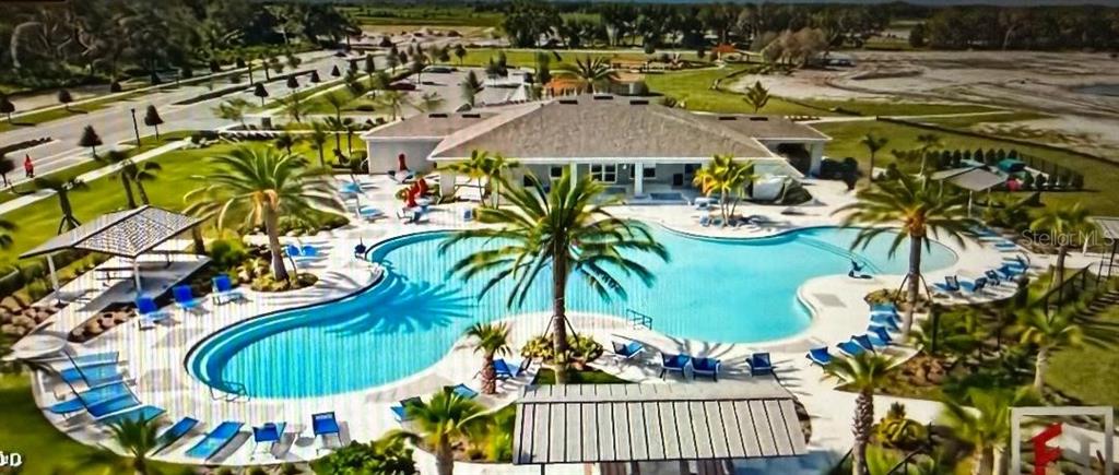 1872 Rustic Falls Drive Kissimmee, FL 34744 - Photo 27 of 30 a view of swimming pool with outdoor seating and plants