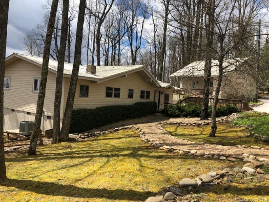 a view of a house with snow on the background
