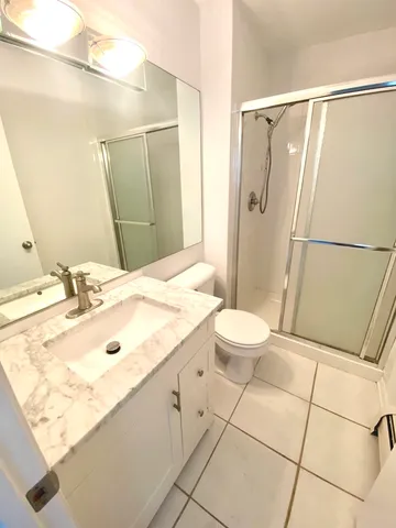 a bathroom with a sink and shower