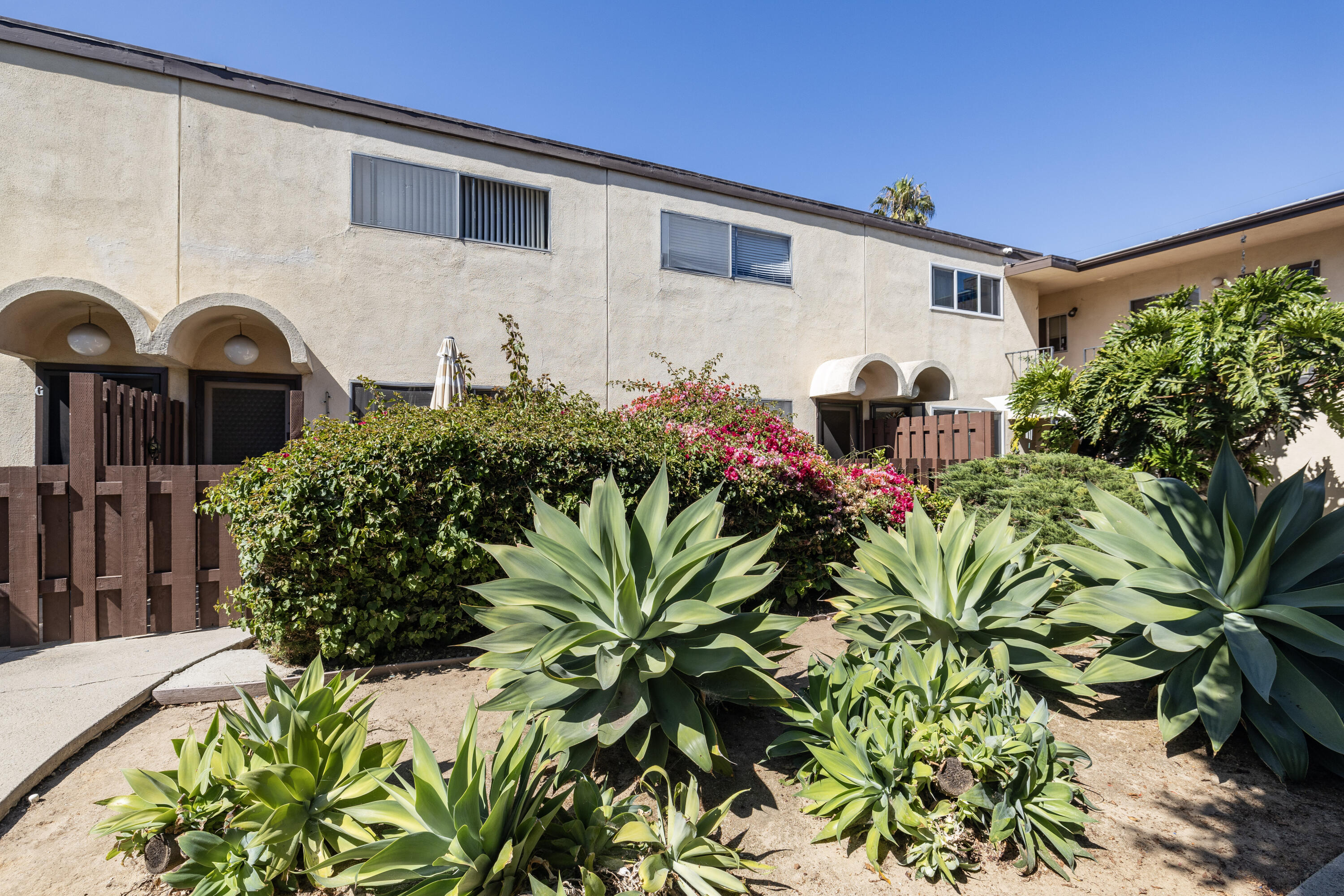 110 Bodega Lane Santa Barbara, CA 93110 - Photo 2 of 3 a front view of a house with a yard