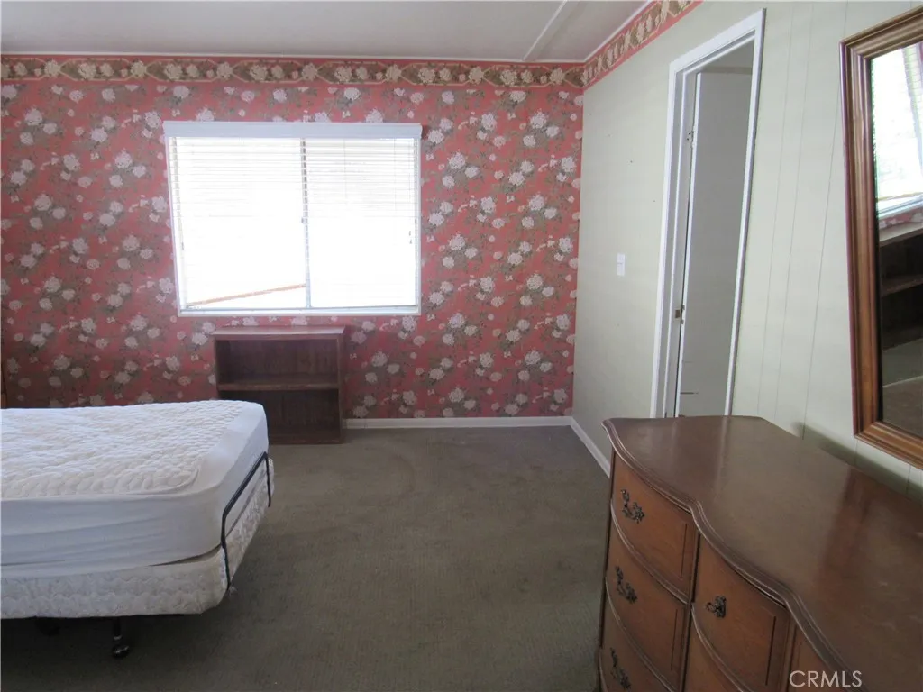 27701 Murrieta Road, Unit 6 Menifee, CA 92586 - Photo 20 of 28 a room with a bed and a window