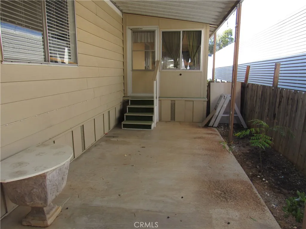 27701 Murrieta Road, Unit 6 Menifee, CA 92586 - Photo 23 of 28 a view of a house with a backyard