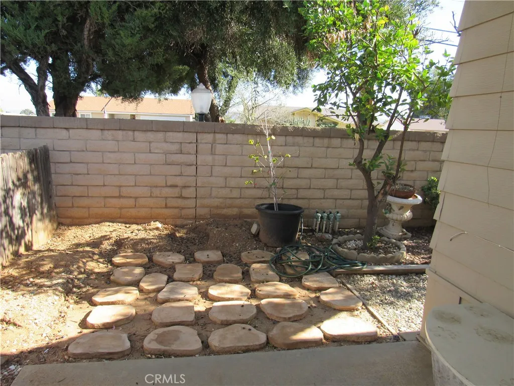 27701 Murrieta Road, Unit 6 Menifee, CA 92586 - Photo 24 of 28 a backyard of a house