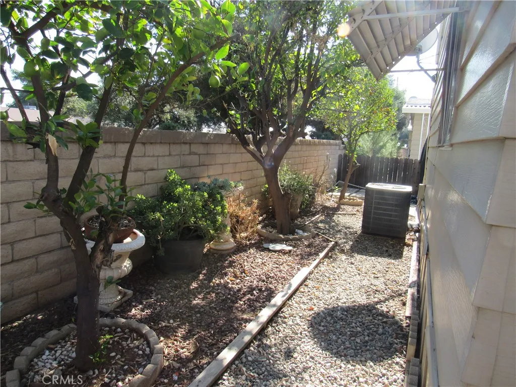 27701 Murrieta Road, Unit 6 Menifee, CA 92586 - Photo 25 of 28 a backyard of a house with lots of green space
