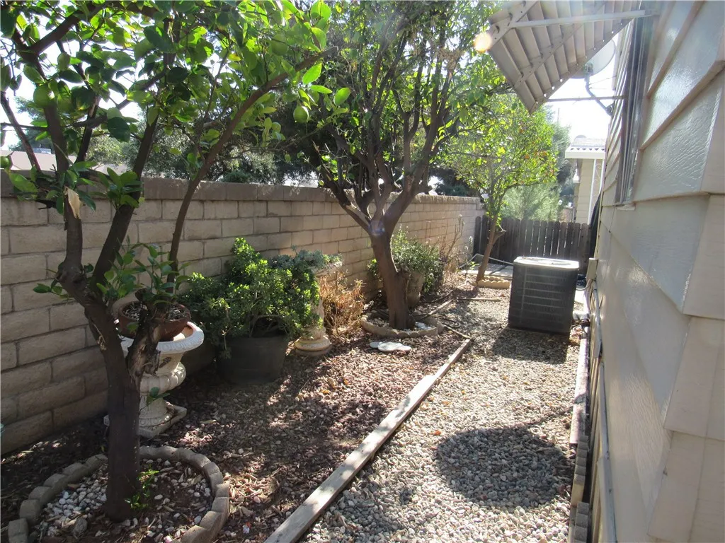 27701 Murrieta Road, Unit 6 Menifee, CA 92586 - Photo 25 of 28 a backyard of a house with lots of green space
