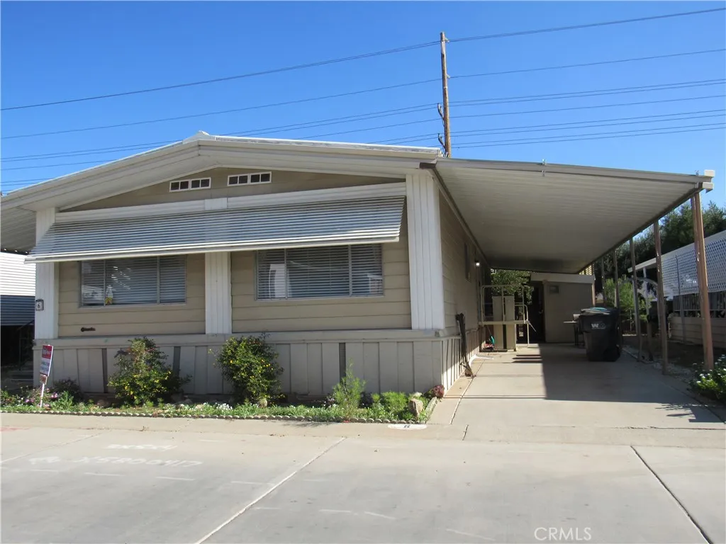 27701 Murrieta Road, Unit 6 Menifee, CA 92586 - Photo 4 of 28 a front view of a house with a garage