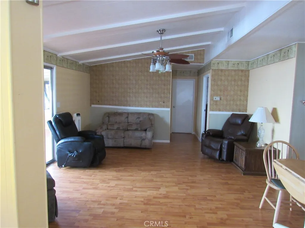 27701 Murrieta Road, Unit 6 Menifee, CA 92586 - Photo 8 of 28 a living room with furniture and a chandelier