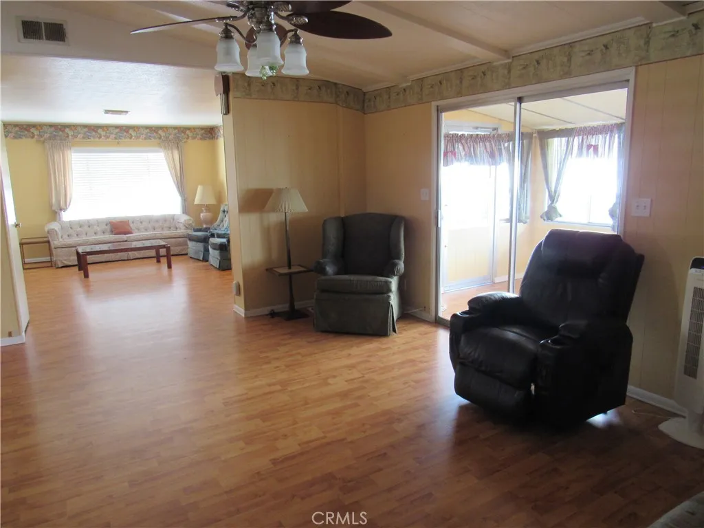 27701 Murrieta Road, Unit 6 Menifee, CA 92586 - Photo 10 of 28 a living room with furniture and a large window