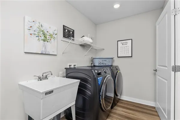 a utility room with multiple dryer and washer