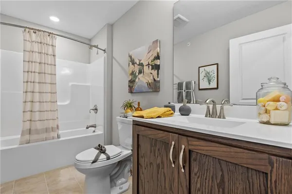 a view of a bathroom with a sink and a mirror