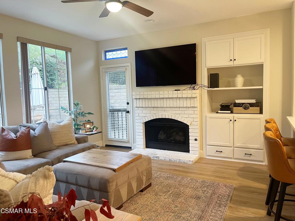 2437 Whitechapel Place Thousand Oaks, CA 91362 - Photo 11 of 36 a living room with furniture fireplace and flat screen tv