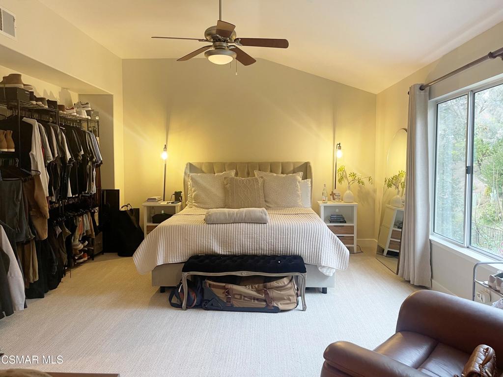 2437 Whitechapel Place Thousand Oaks, CA 91362 - Photo 21 of 36 a bedroom with a bed couch and a window