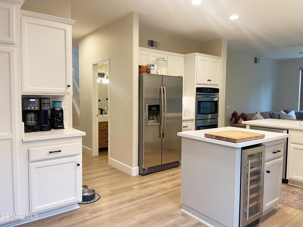 2437 Whitechapel Place Thousand Oaks, CA 91362 - Photo 7 of 36 a kitchen with a sink stove and refrigerator
