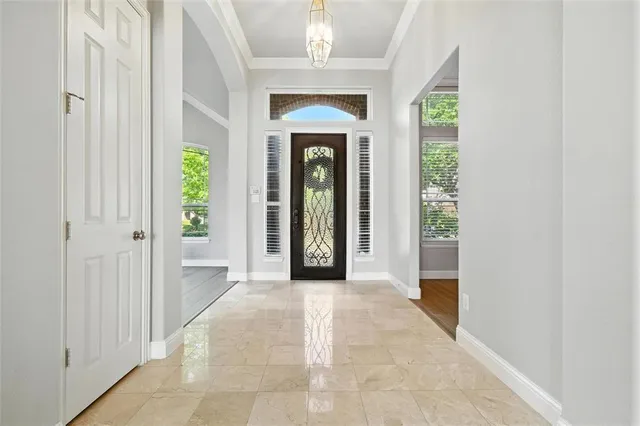 a view of a hallway with windows