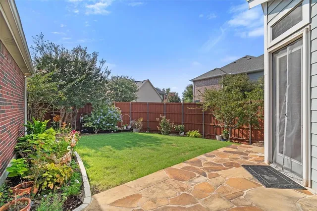 a view of a back yard from a patio