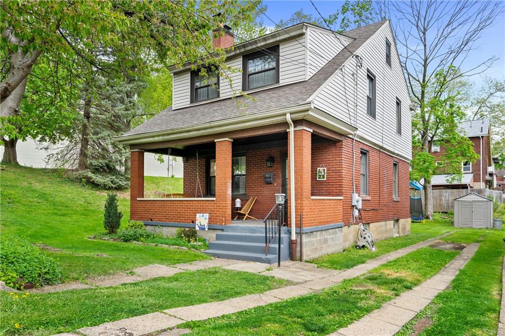 416 Maple Avenue Pittsburgh, PA 15215 - Photo 2 of 38 a front view of a house with a yard table and chairs