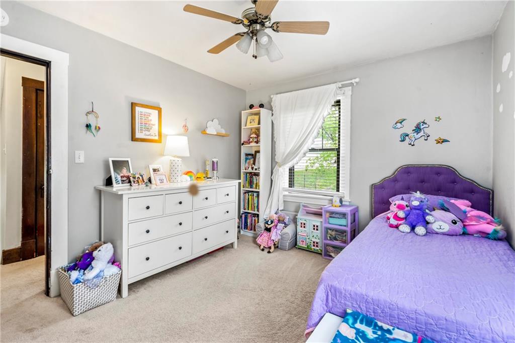 416 Maple Avenue Pittsburgh, PA 15215 - Photo 21 of 38 a bedroom with a bed and a window