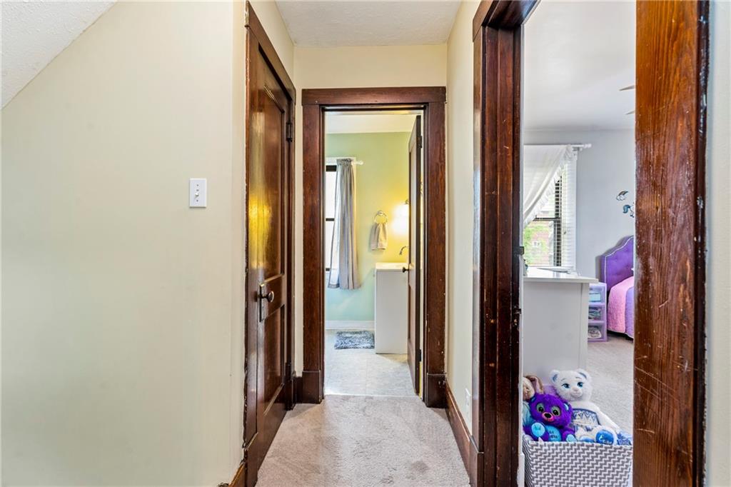 416 Maple Avenue Pittsburgh, PA 15215 - Photo 23 of 38 a view of a hallway with a room that has mirror in front of it