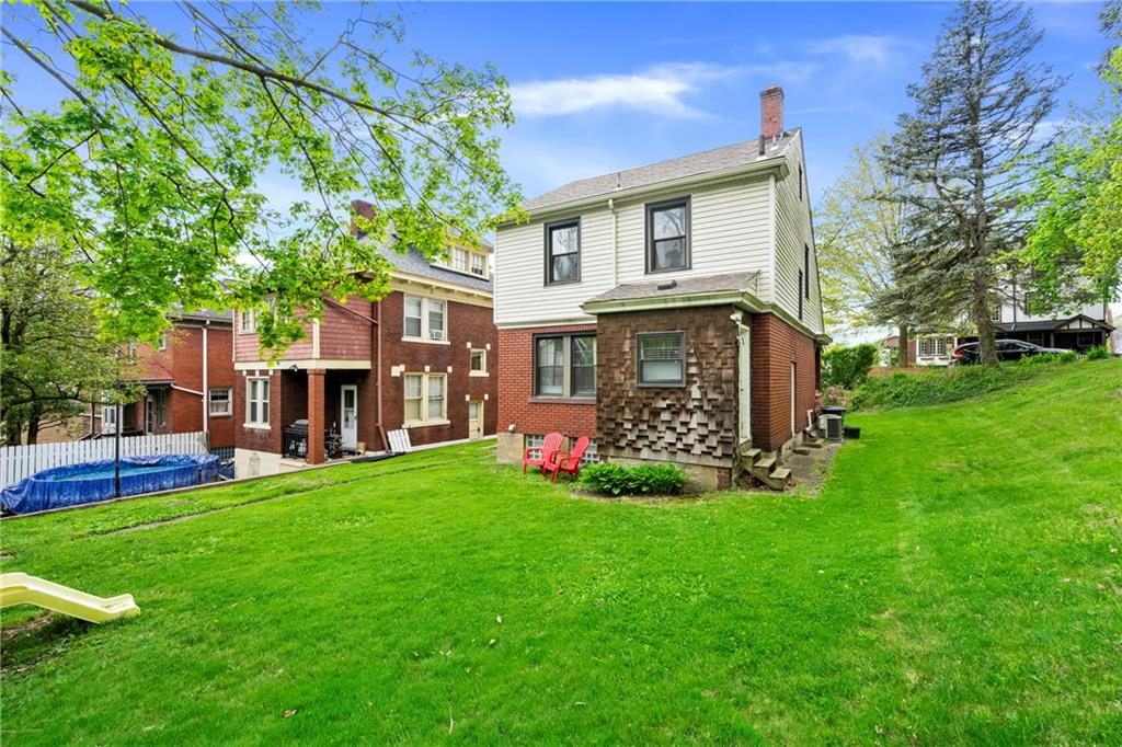 416 Maple Avenue Pittsburgh, PA 15215 - Photo 27 of 38 a view of a house with a yard and sitting area