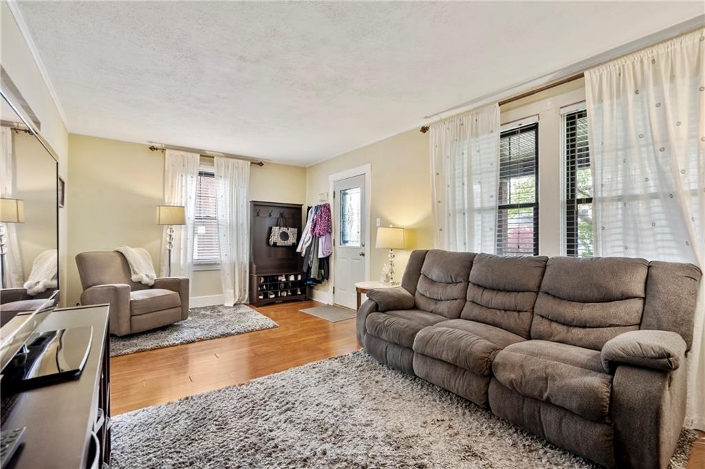 416 Maple Avenue Pittsburgh, PA 15215 - Photo 7 of 38 a living room with furniture window and a table