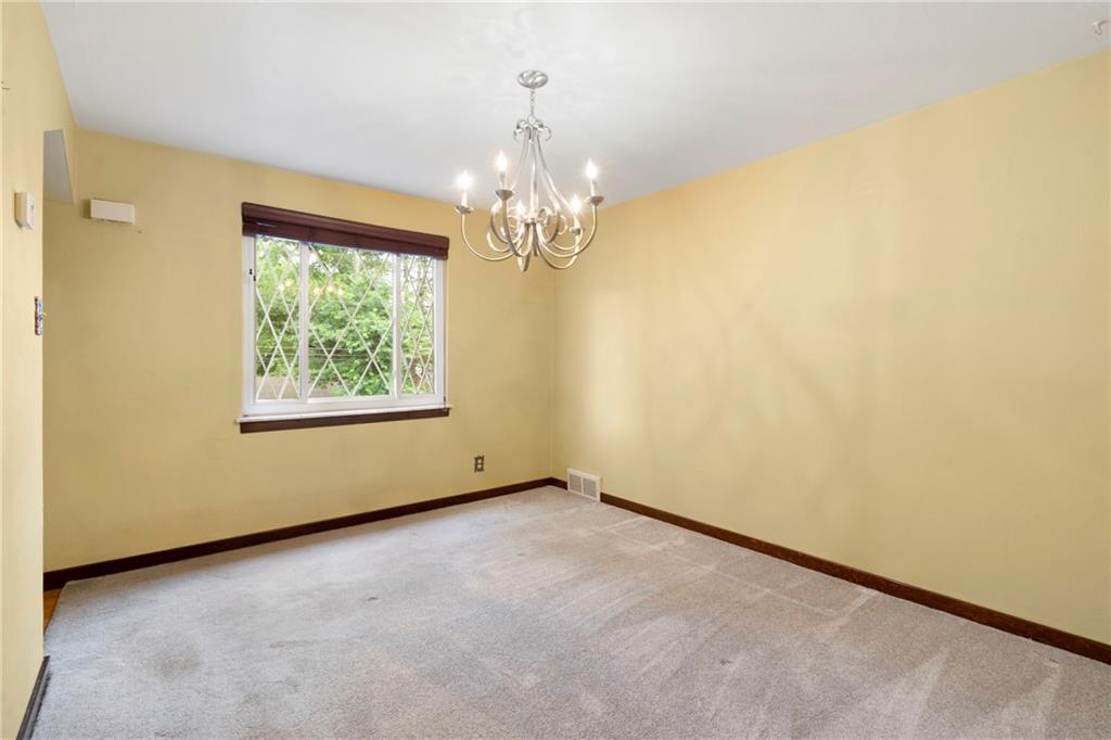 459 Filmore Road Pittsburgh, PA 15221 - Photo 6 of 23 an empty room with windows and entrance
