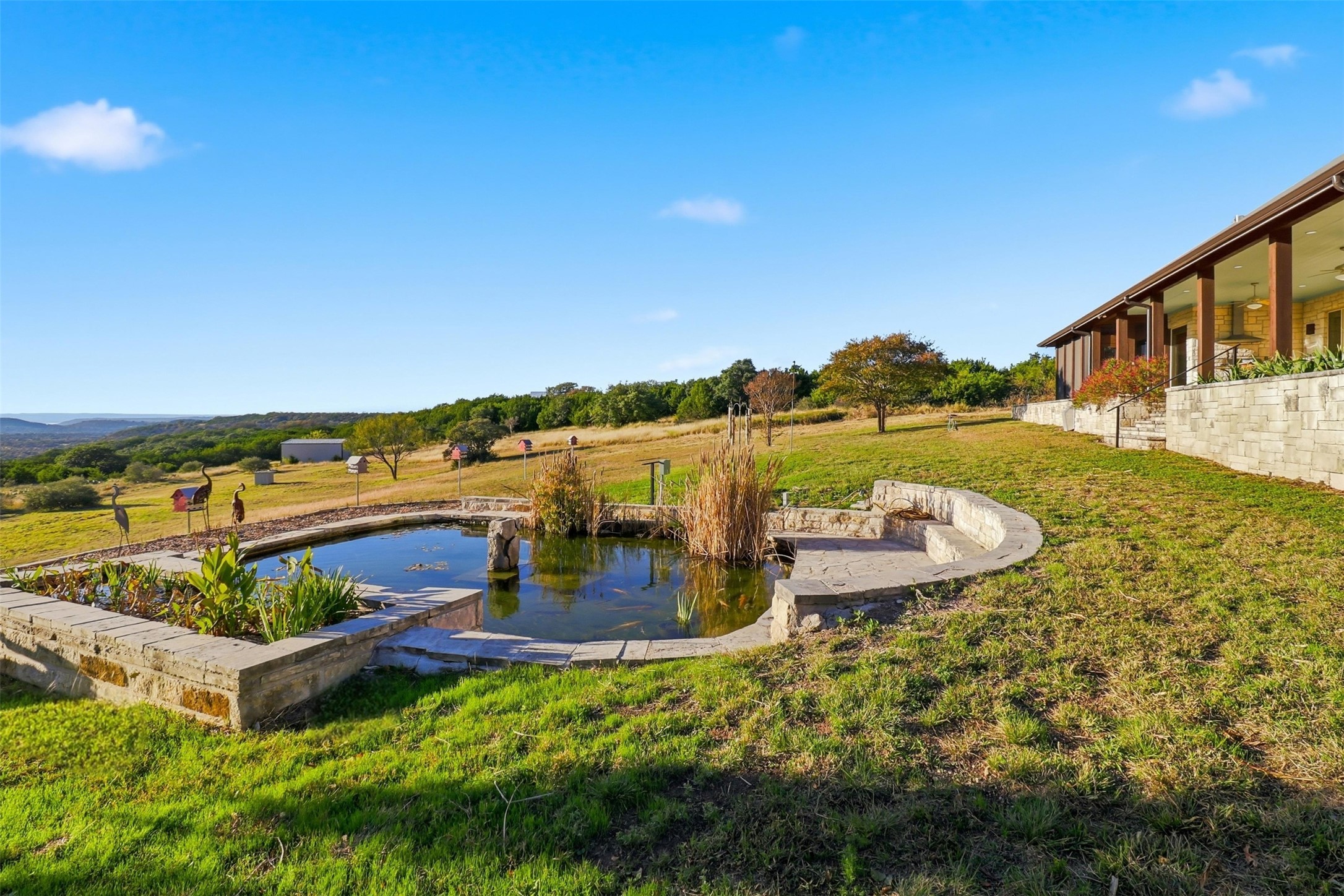 450 Threadgill Ranch Road Burnet, TX 78611 - Photo 21 of 33 swimming view with lake view and mountain view