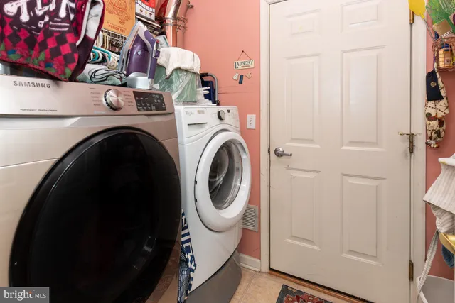a kitchen with stainless steel appliances a refrigerator and a stove top oven